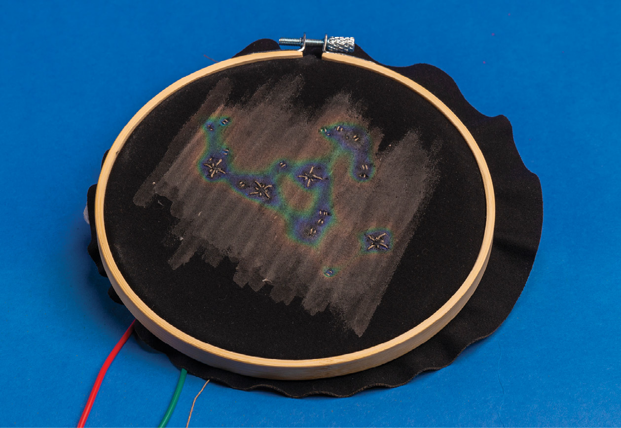 embroidered pieces use heating circuits made of conductive thread that activates liquid crystal ink to make dynamic color changes.