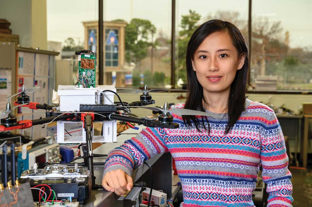 Yan Wan in a lab with an autonomus drone.