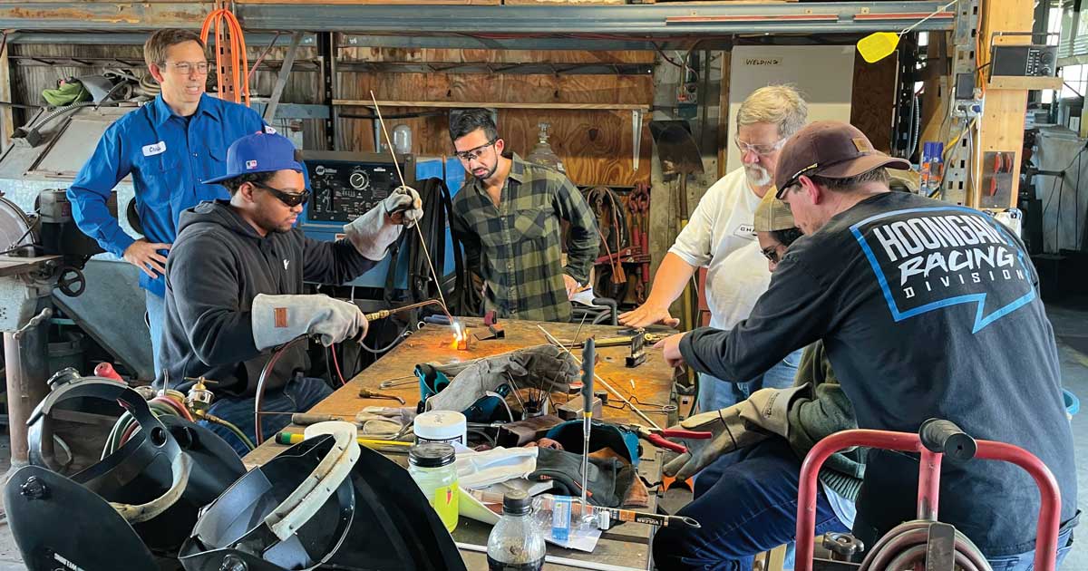 Dr. Chris Boyer and some resource and energy engineering students in a lab.