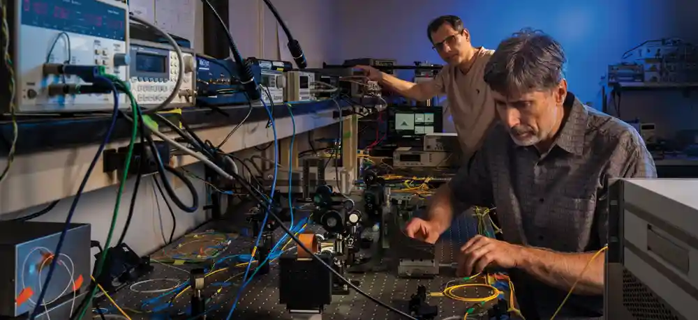 Michael Vasilyev works in the lab on quantum research.